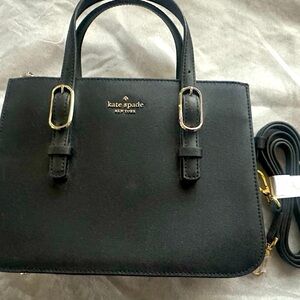 Kate Spade top handle handbag with crossbody strap.